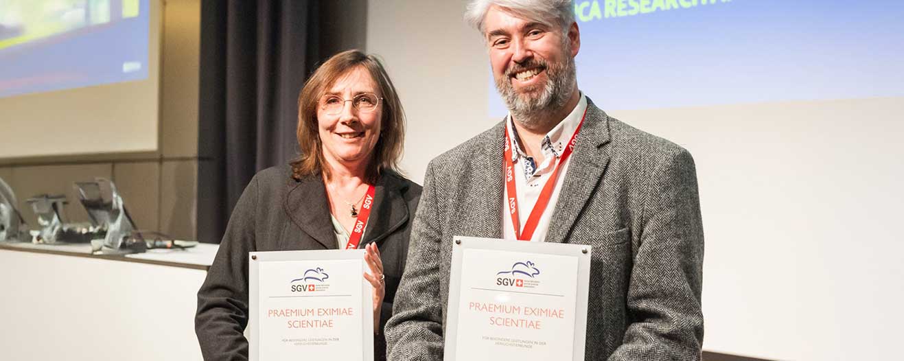 Penny Hawkins and colleague receiving their certificate of excellence.